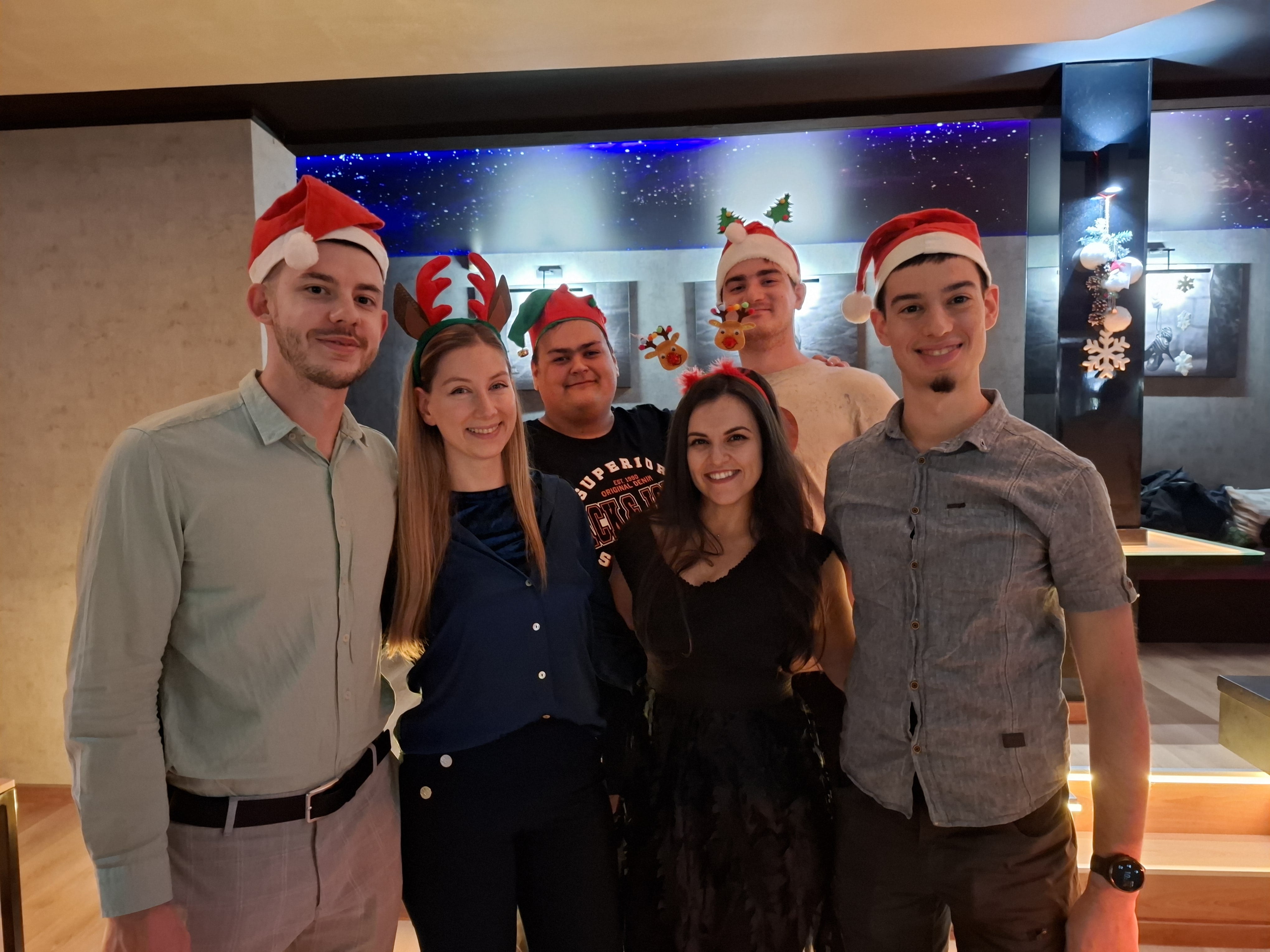 Christmas party photo with teammates